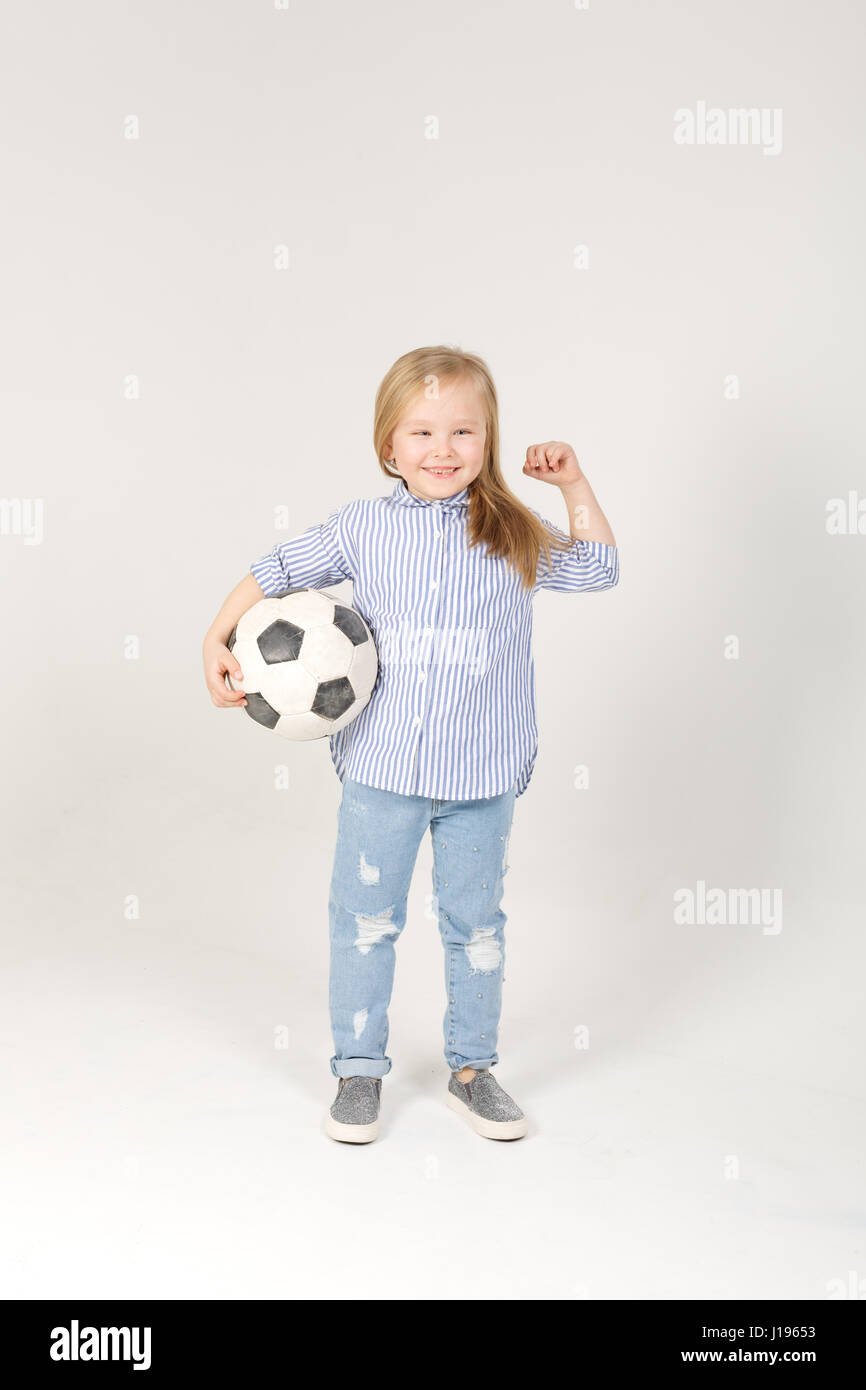 pretty little blonde girl with soccer ball Stock Photo