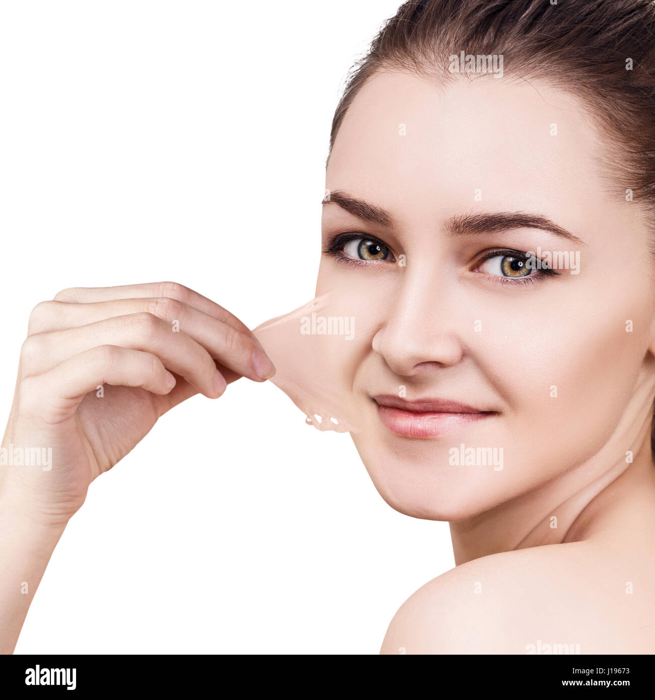 Woman remove her old dry skin from face. Stock Photo