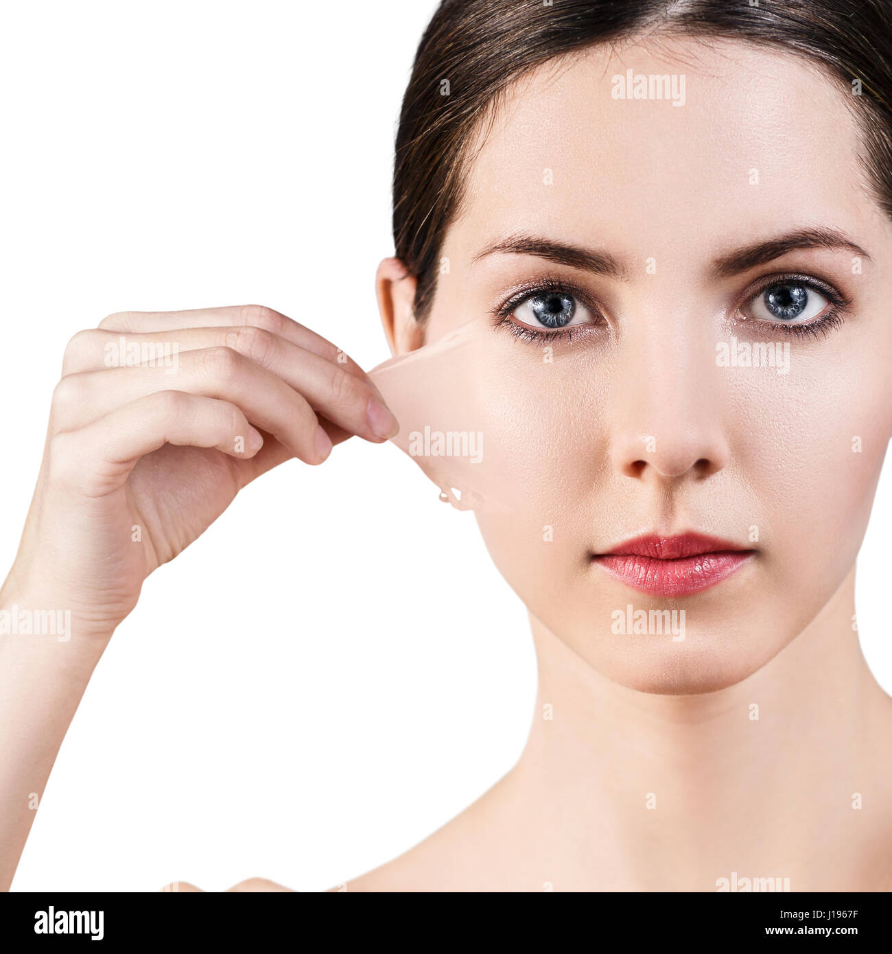 Woman remove her old dry skin from face. Stock Photo