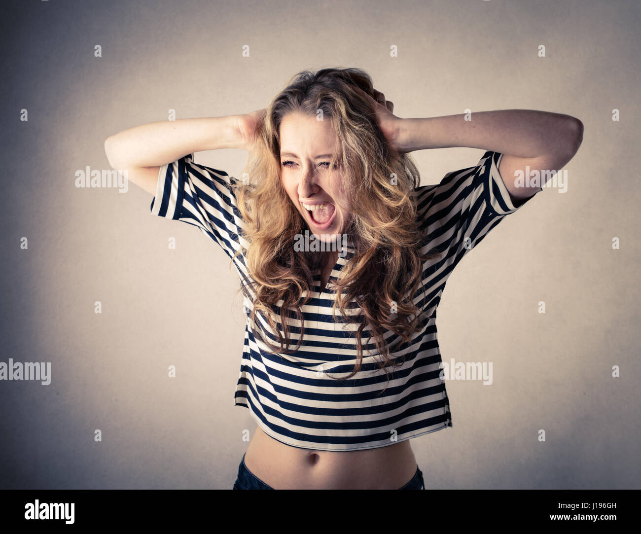 Blond woman shouting Stock Photo