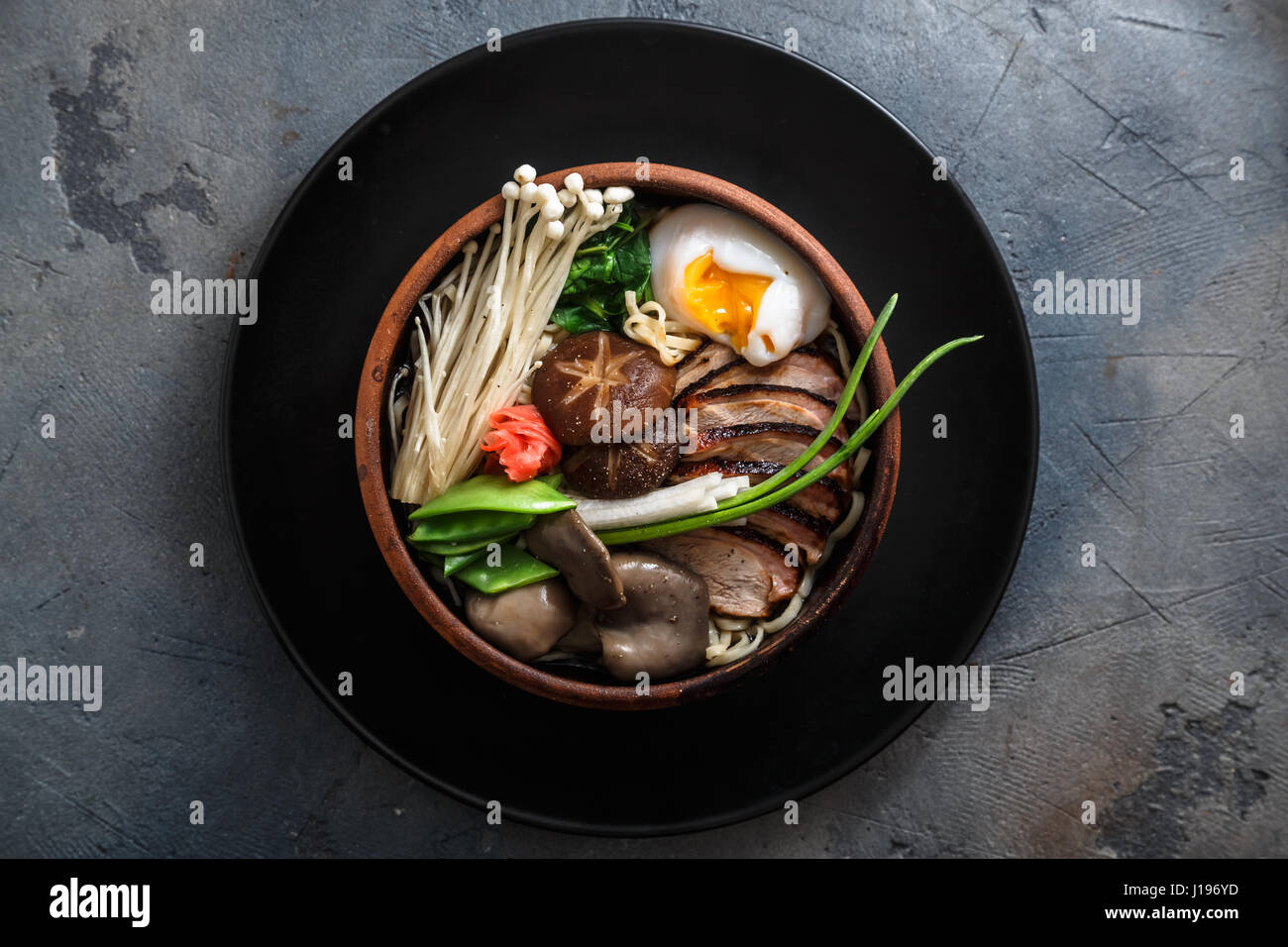 Ramen noodles with duck, egg, enoki and shiitake mushrooms with broth