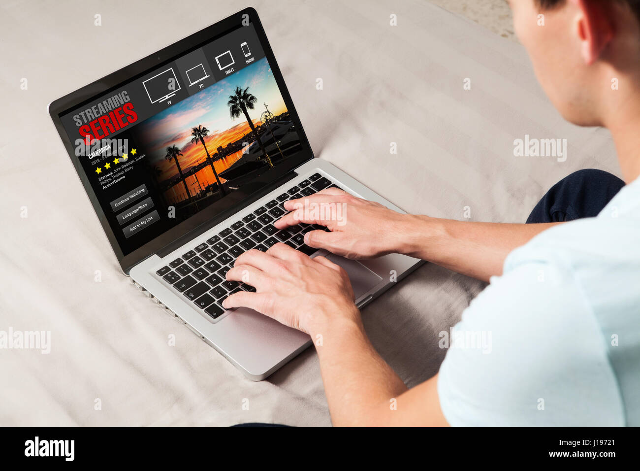 Man watching tv series in a laptop computer at home Stock Photo - Alamy