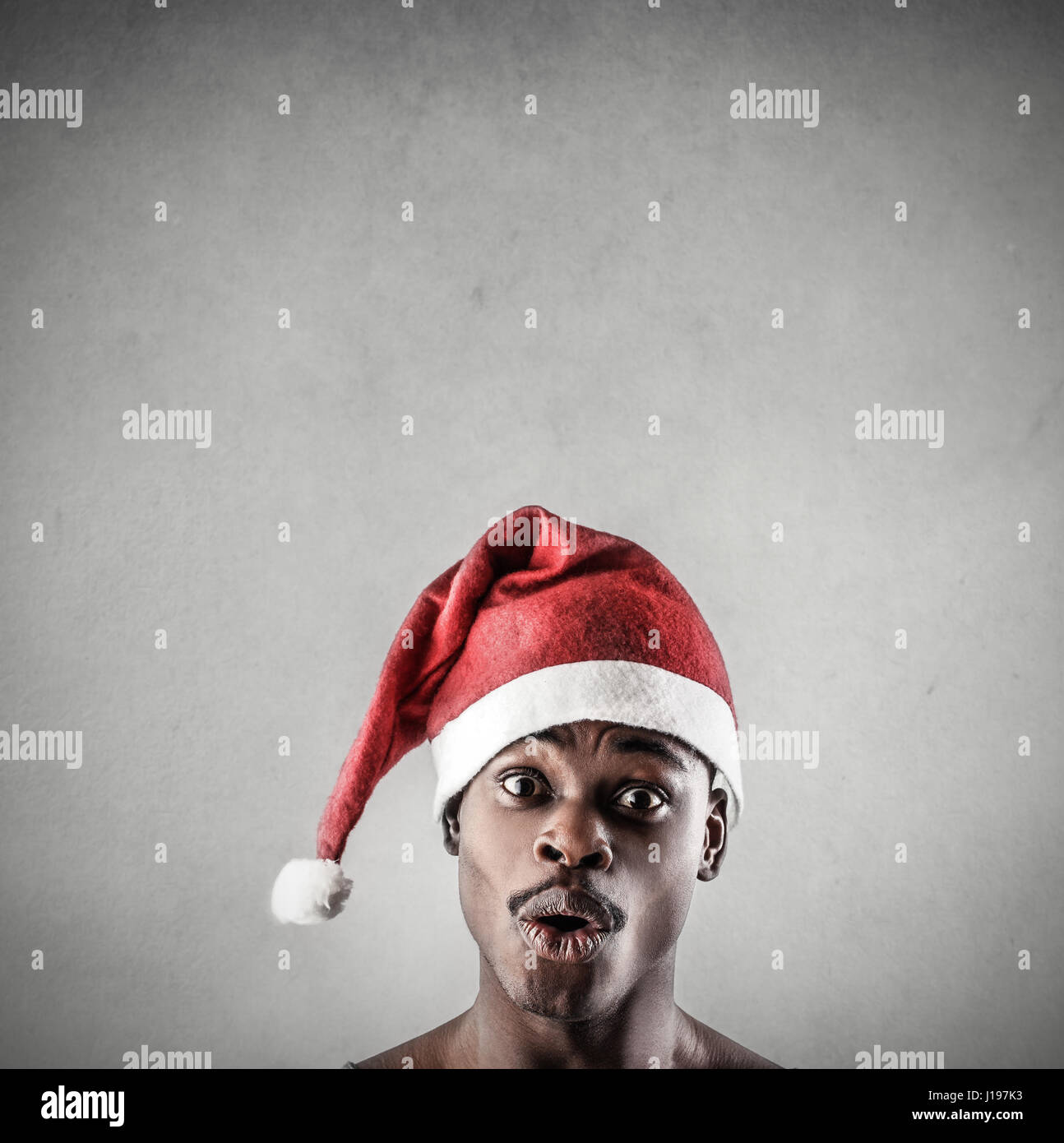 African man in santa hat hi-res stock photography and images - Alamy