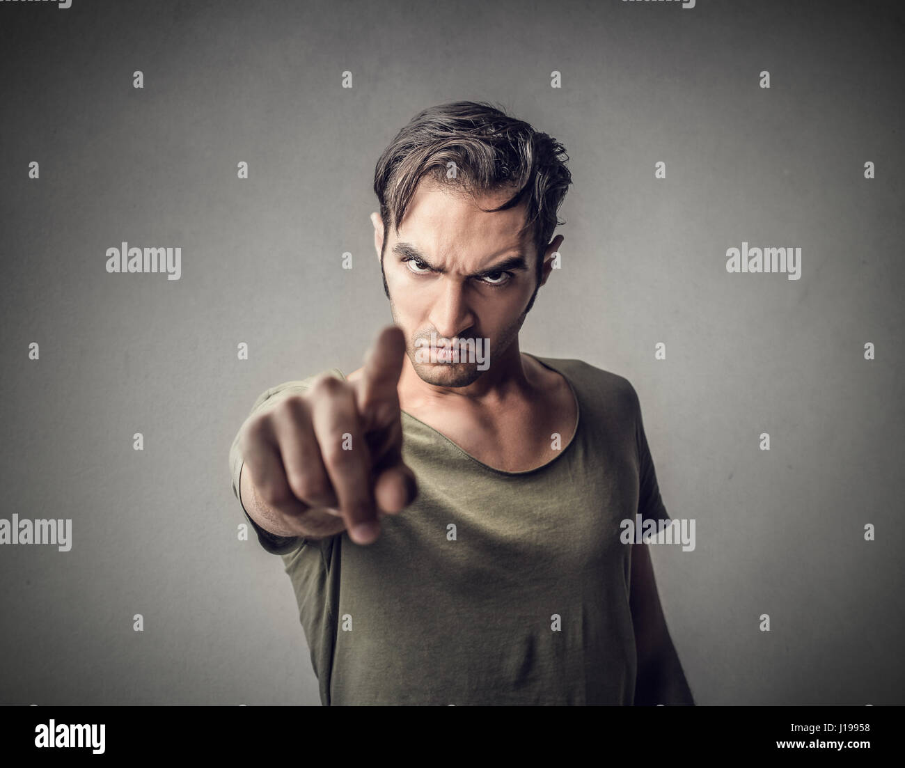 Mad man pointing at you Stock Photo