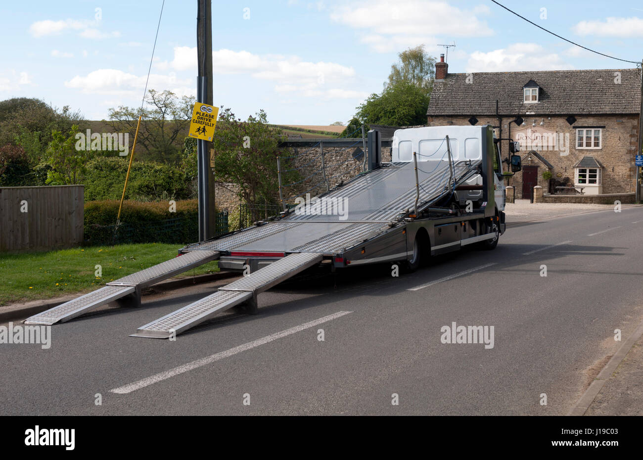 Car transporter with its ramps down, Oxfordshire, UK Stock Photo
