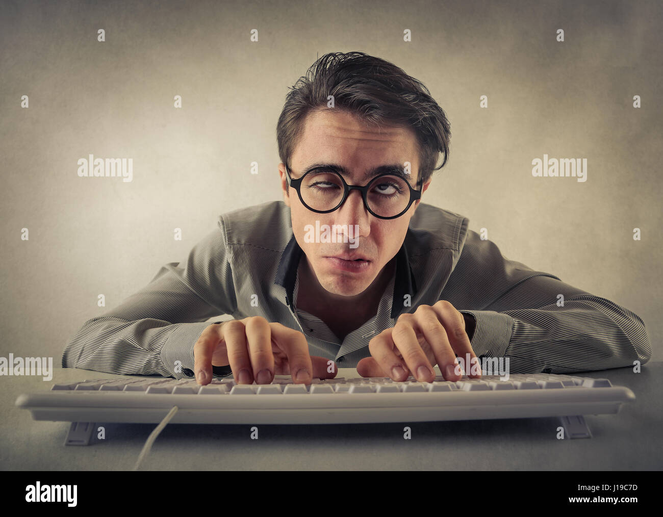 Tired man in front of computer Stock Photo