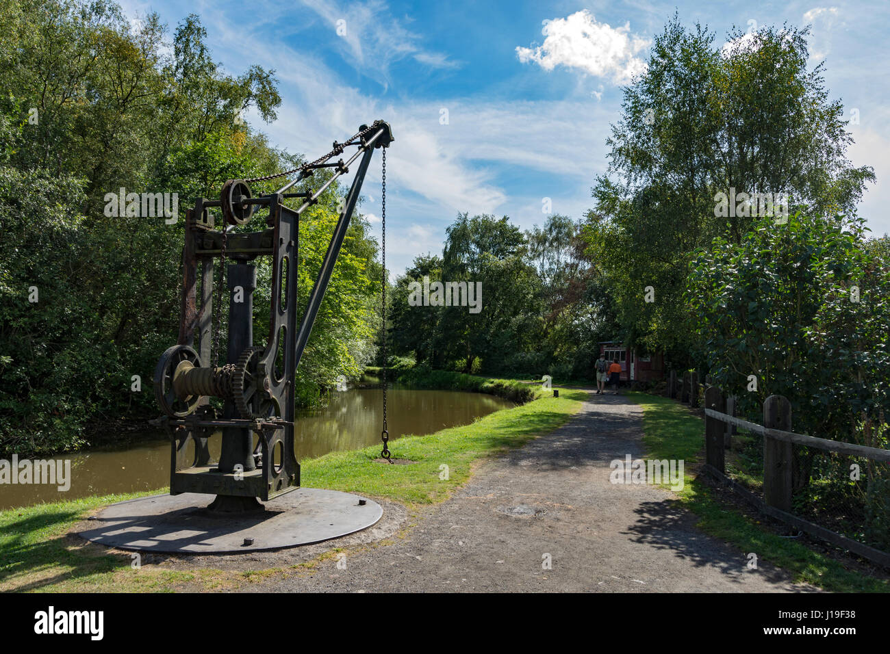 The Shropshire Canal and a manually operated derrick crane at the Blists Hill Victorian Town, near Madeley, Shropshire, England, UK. Stock Photo