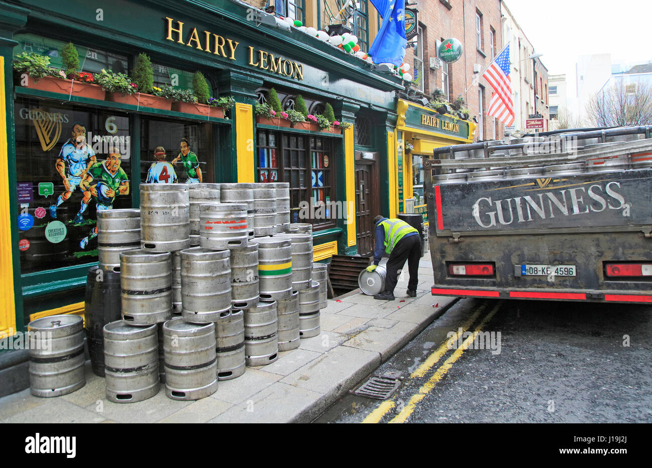 Delivery of Guinness beer barrels to traditional pub, city of Dublin