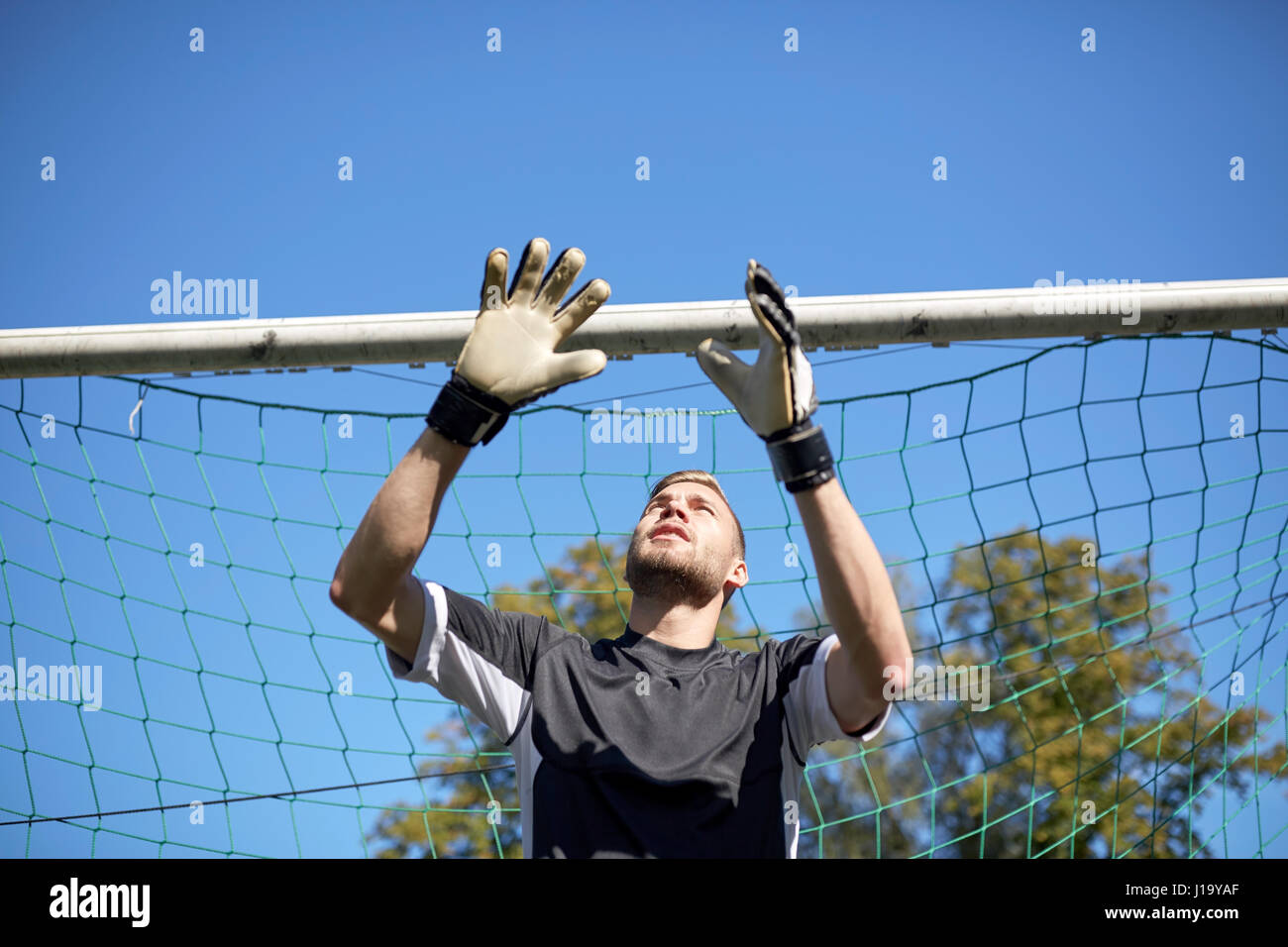 goalkeeper or soccer player at football goal Stock Photo