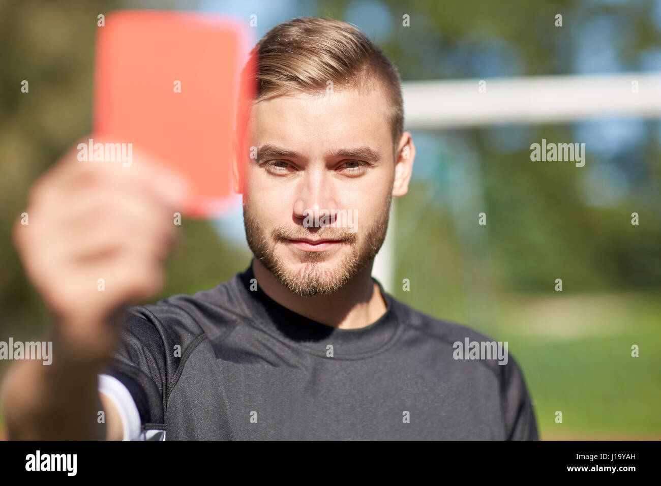 Referee On Football Field Showing Red Card Stock Photo Alamy