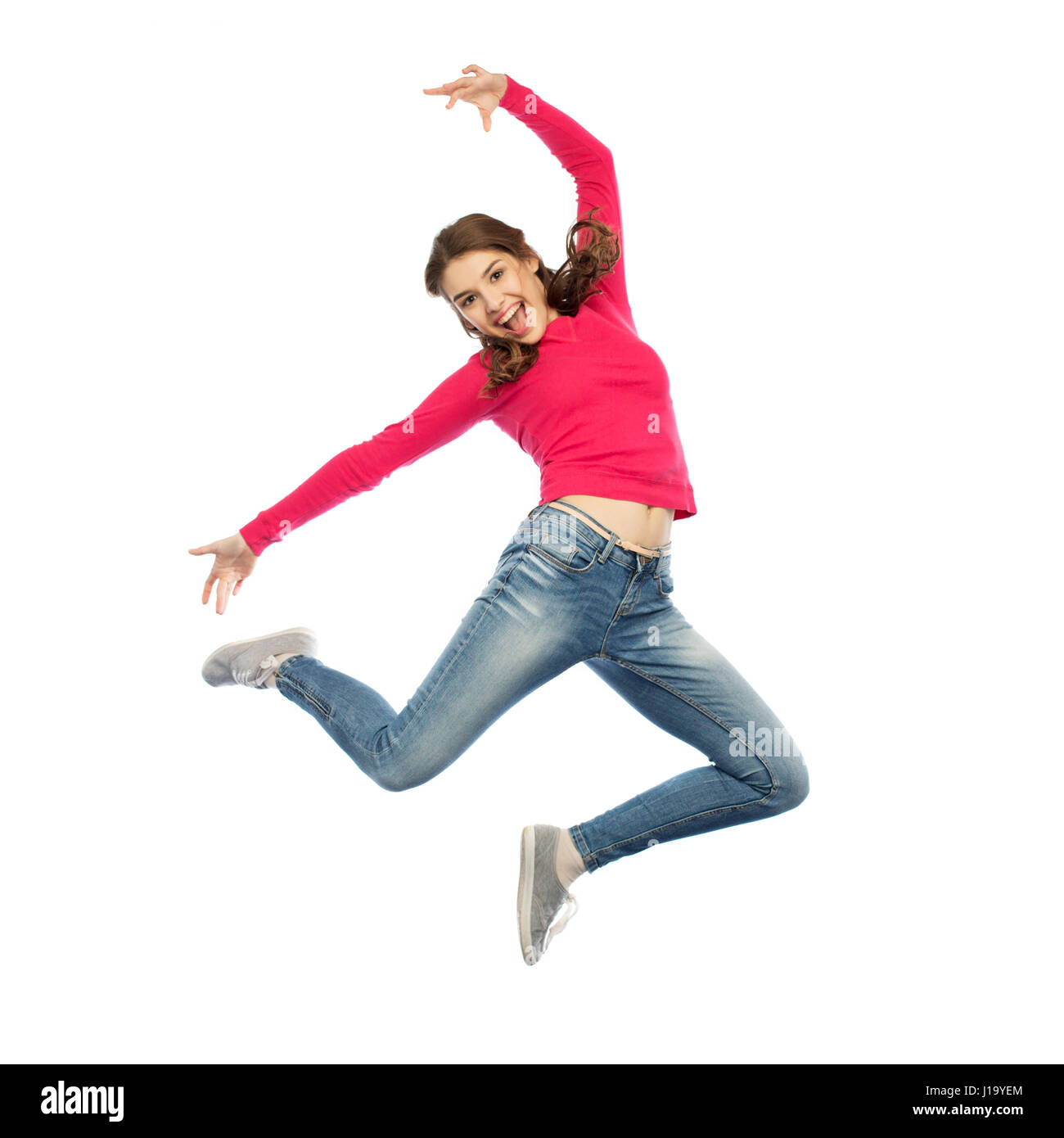 happy young woman jumping in air or dancing Stock Photo - Alamy