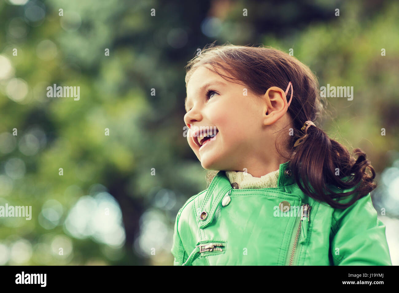 happy beautiful little girl portrait outdoors Stock Photo - Alamy