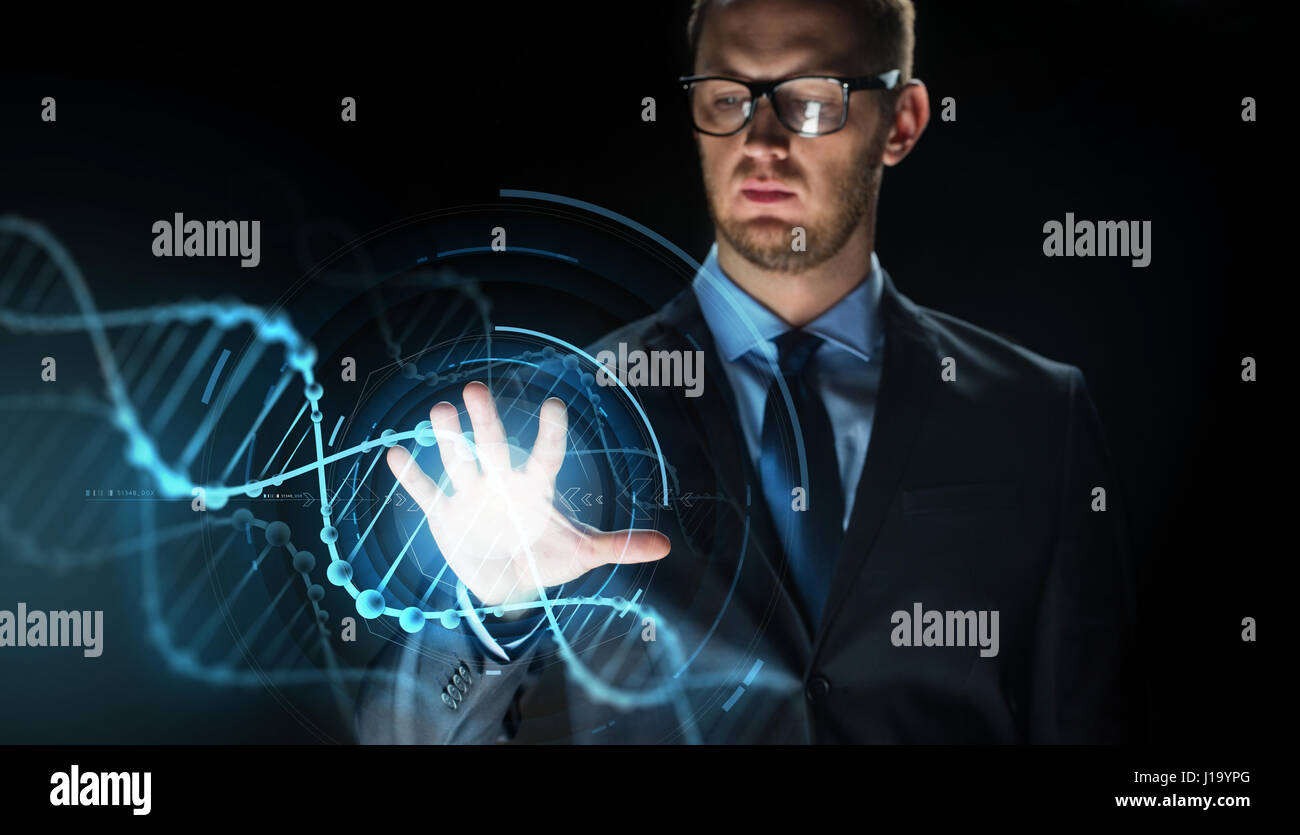 businessman with virtual dna molecule projection Stock Photo - Alamy