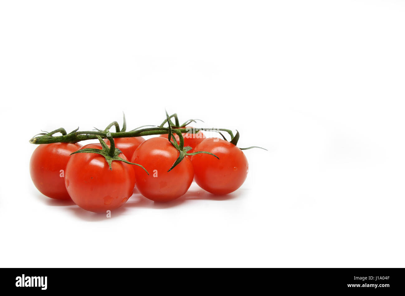Red cherry tomato isolated on white background Stock Photo - Alamy