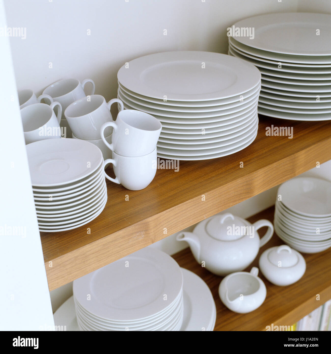 https://c8.alamy.com/comp/J1A2EN/a-shelf-of-tableware-J1A2EN.jpg