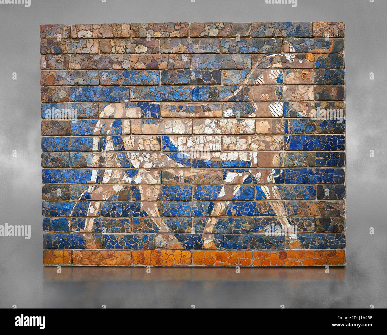 Coloured glazed brick panels depicting bulls, the symbol of the weather god Adad, from the facade of the  first smaller Ishtar Gate, Babylon, dating f Stock Photo