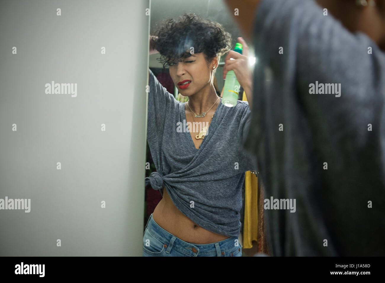 Young woman preparing to go out Stock Photo