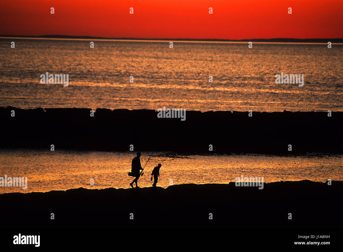 Silhouette father son fishing sunset hi-res stock photography and ...
