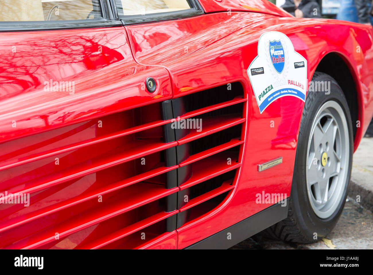 The characteristic straked door louvres of the Ferrari Testarossa deliver air to the twin side-mounted radiators. Stock Photo