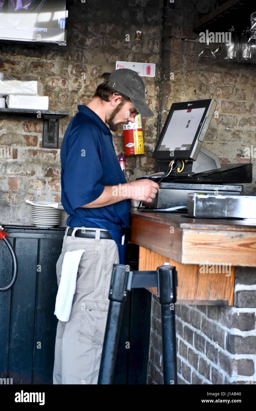 Restaurant server preparing a customers tab Stock Photo Alamy