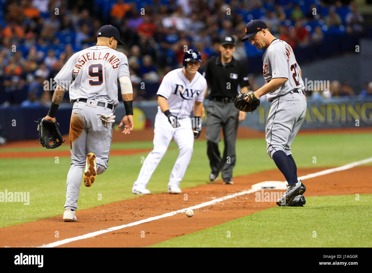St. Petersburg, Florida, USA. 19th Apr, 2017. WILL VRAGOVIC | Times.Detroit Tigers third baseman Nicholas Castellanos (9), left, and starting pitcher Jordan Zimmermann (27) watch as the bunt by Tampa Bay Rays center fielder Kevin Kiermaier (39) stays fair in the first inning of the game between the Detroit Tigers and the Tampa Bay Rays at Tropicana Field in St. Petersburg, Fla. on Wednesday, April 19, 2017. Credit: Will Vragovic/Tampa Bay Times/ZUMA Wire/Alamy Live News Stock Photo