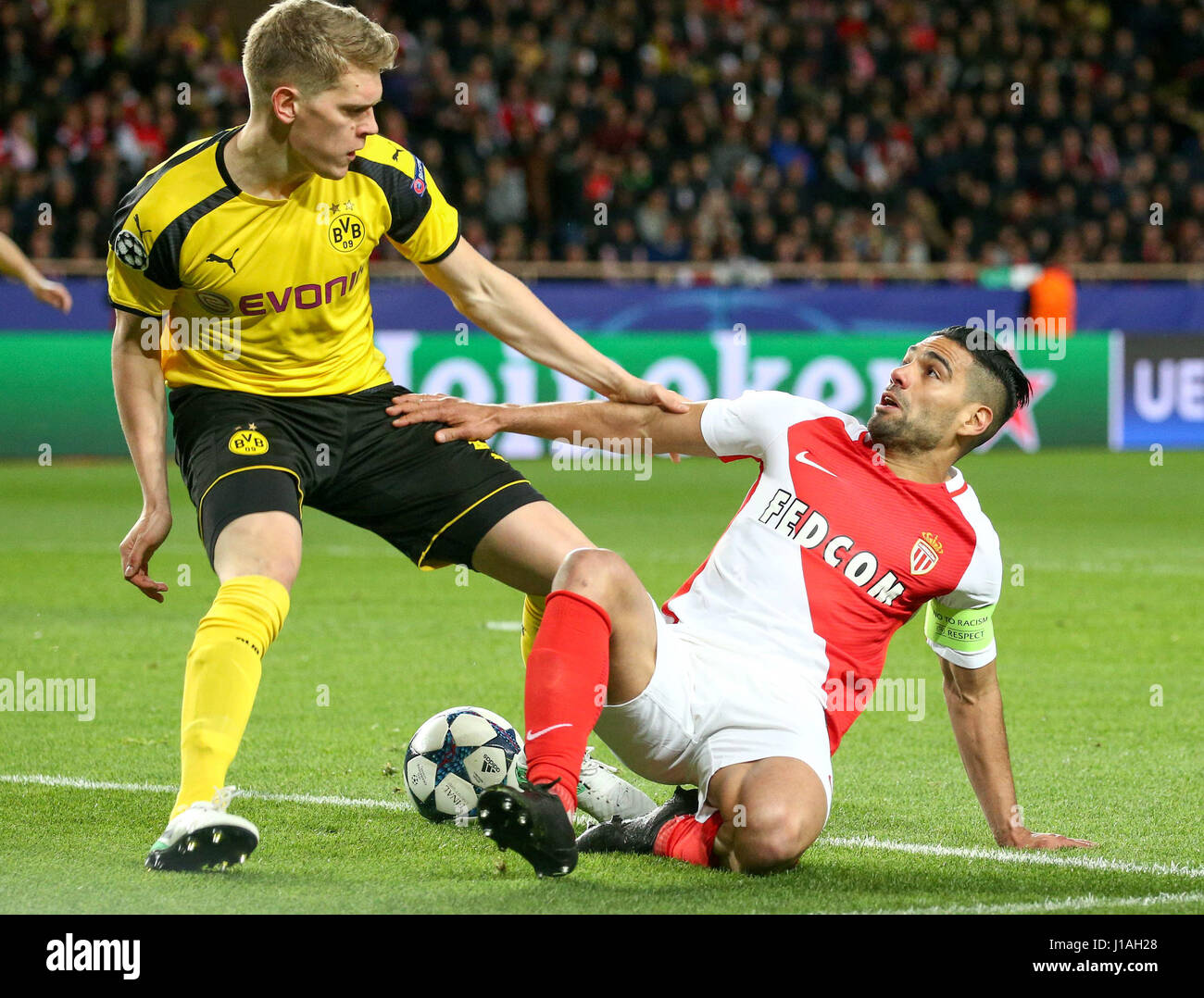 Fontvieille. 19th Apr, 2017. Radamel Falcao(R) of AS Monaco vies with Lukasz Piszczek of Borussia Dortmund during their quaterfinal second leg match of UEFA Champions League in Fontvieille, Monaco on April 19, 2017. Monaco won 3-1 and advanced to the semifinal with 6-3 on aggregate. Credit: Serge Haouzi/Xinhua/Alamy Live News Stock Photo