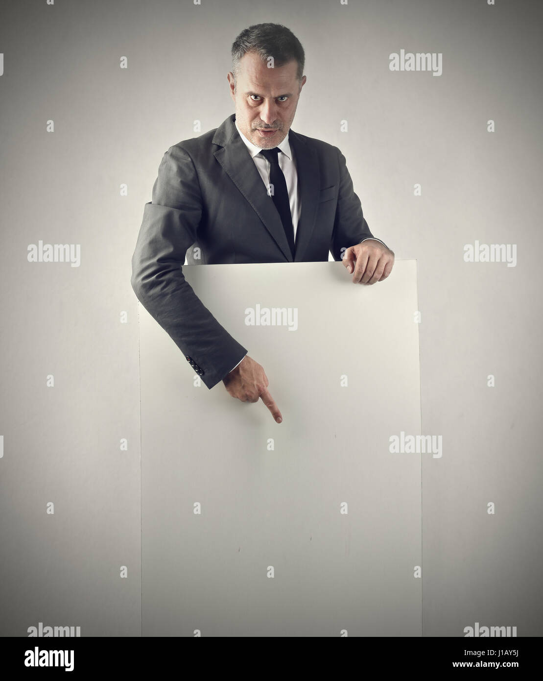 Businessman with empty paper Stock Photo