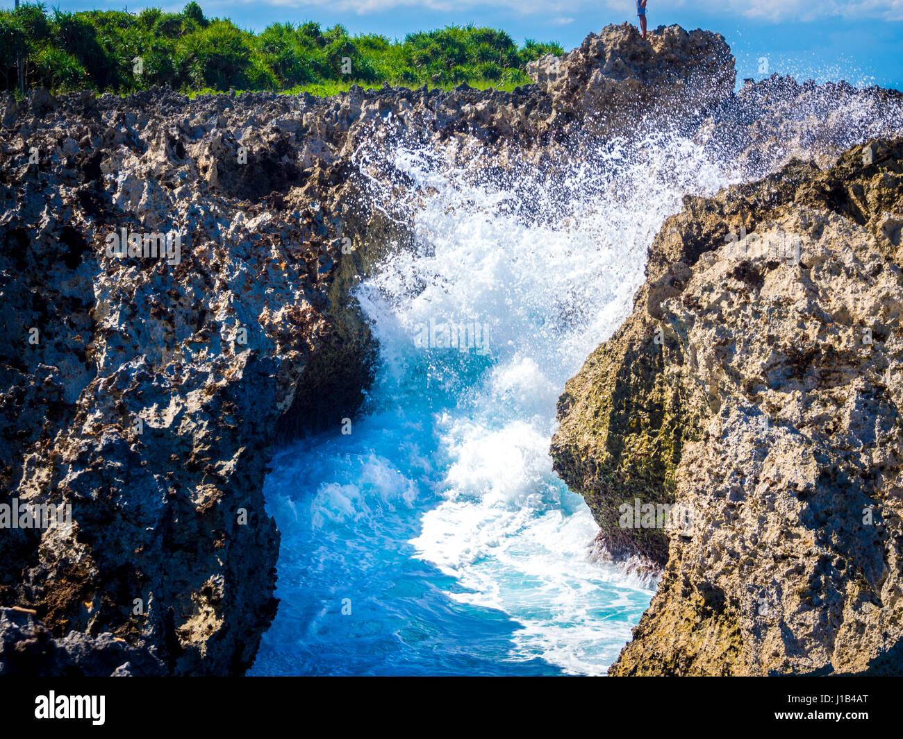 Waves Pounding at Rock in Nusa Dua Beach, Bali Stock Photo