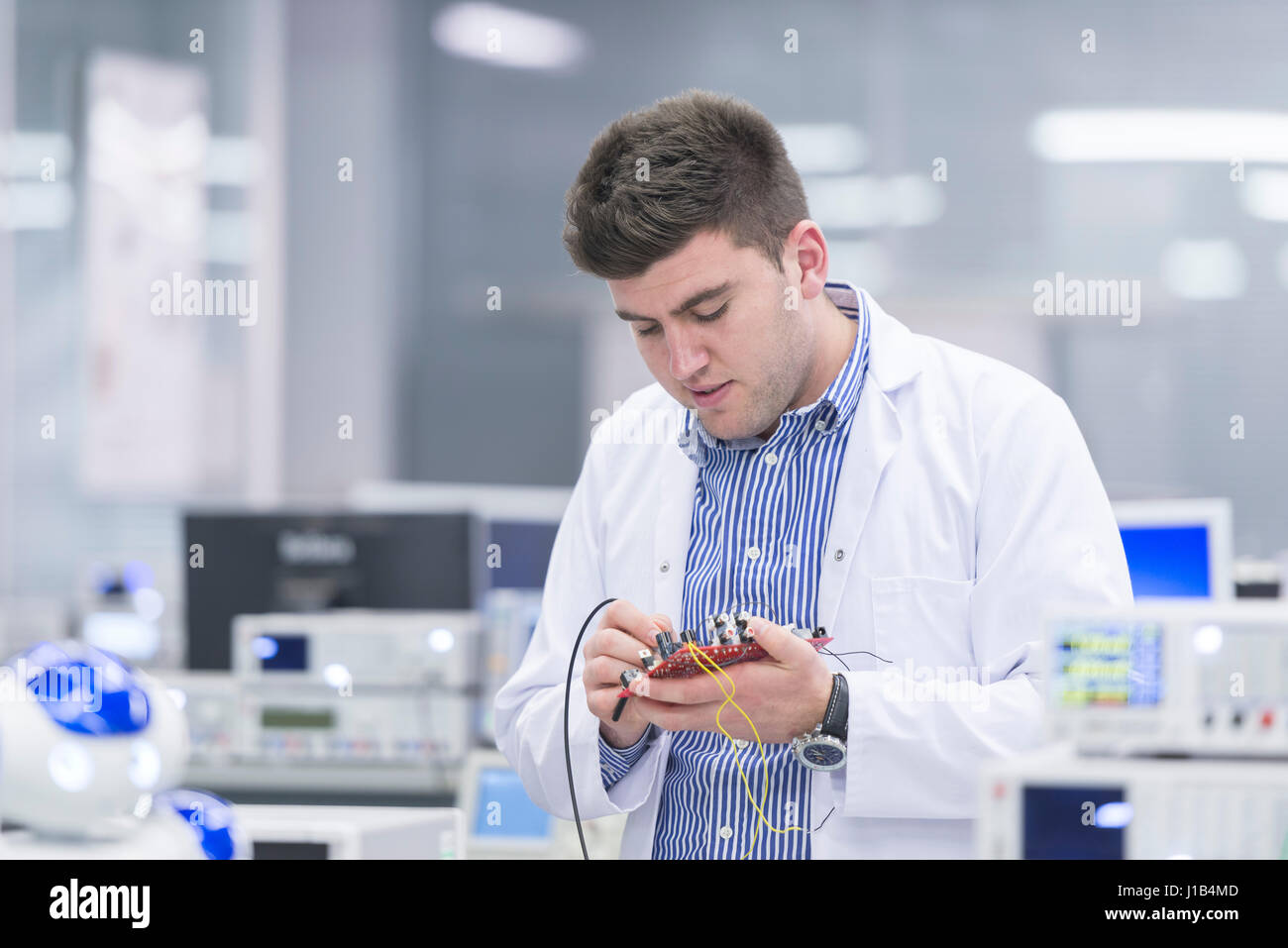 A science laboratory with a scientist investigating electrical
