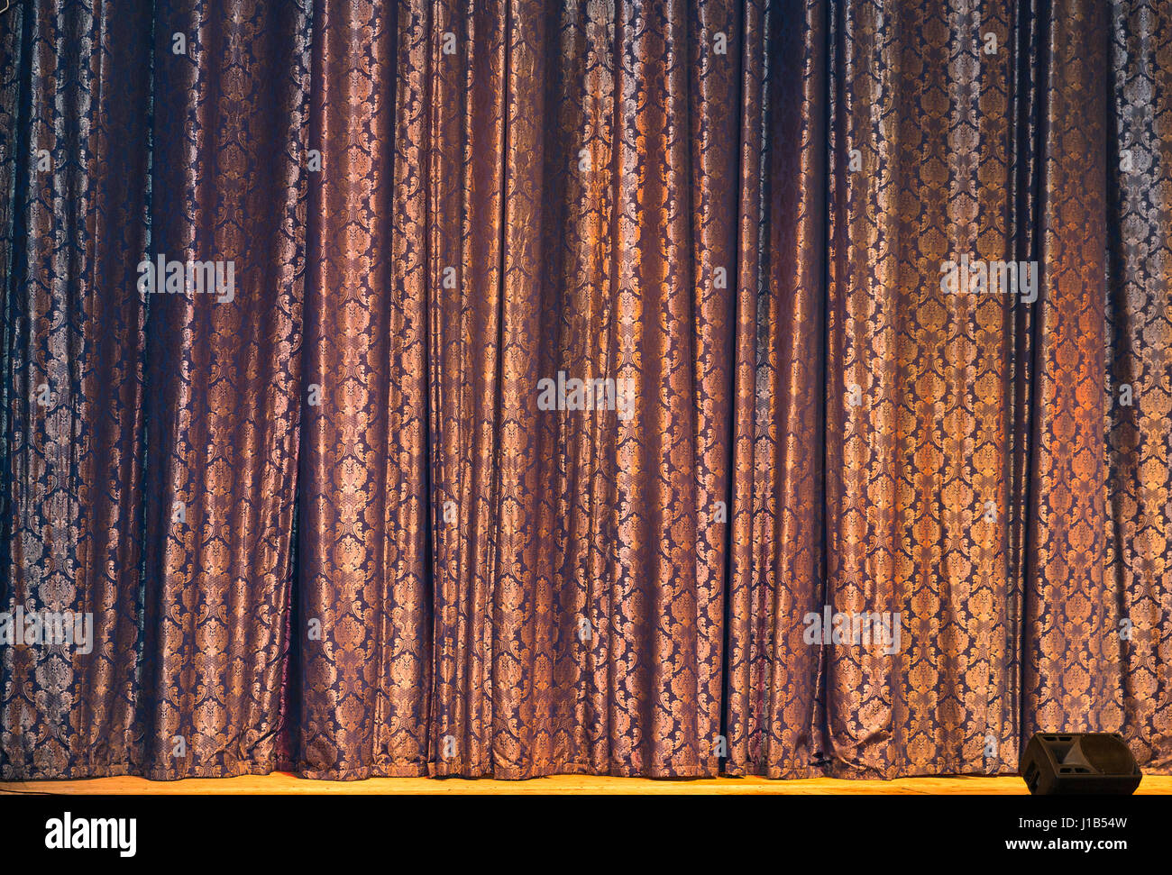 Patterned curtain of stage theater with audio speaker closeup Stock Photo