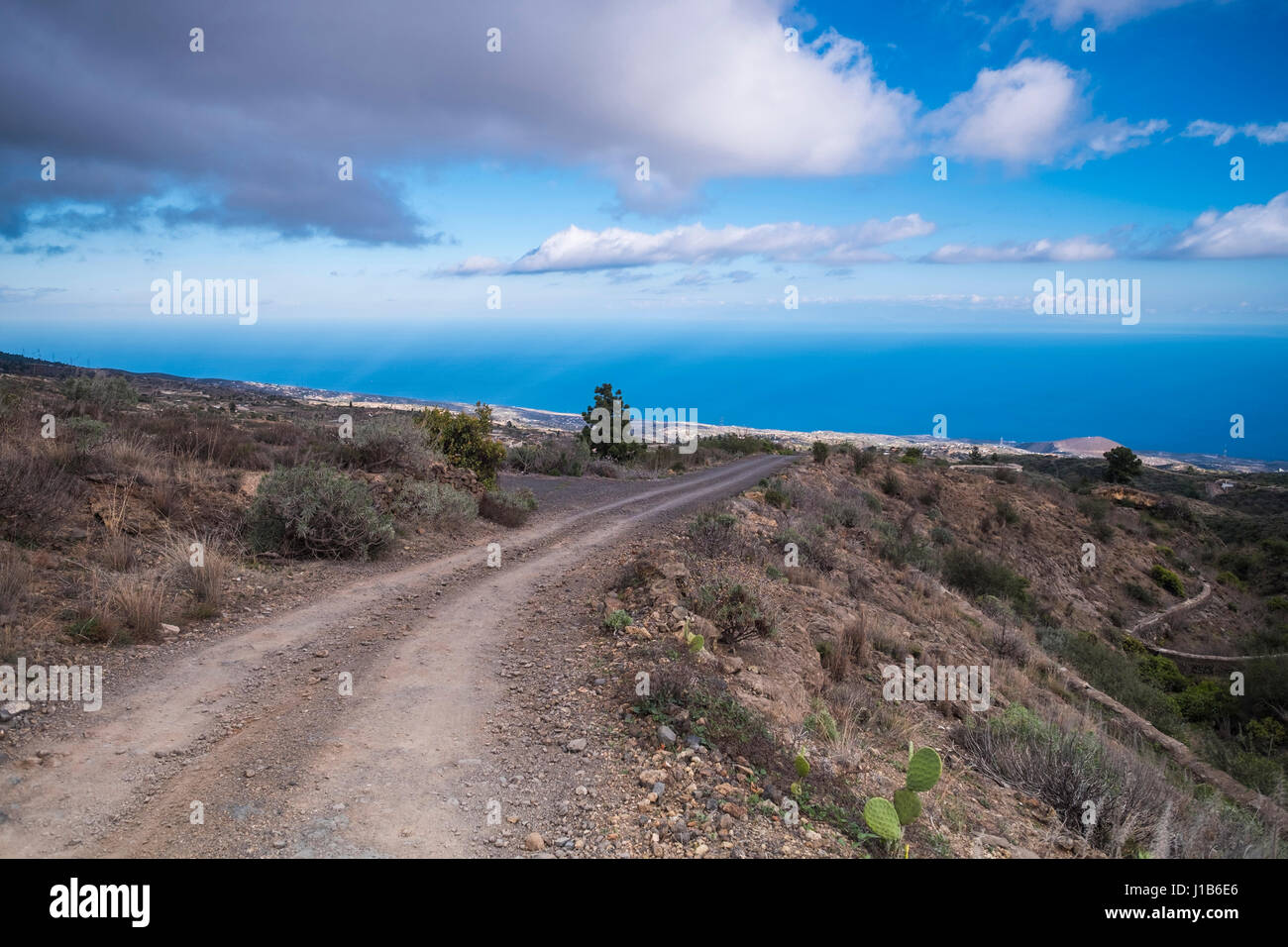 Dirt path near ocean, Arona, Tenerife, Spain Stock Photo