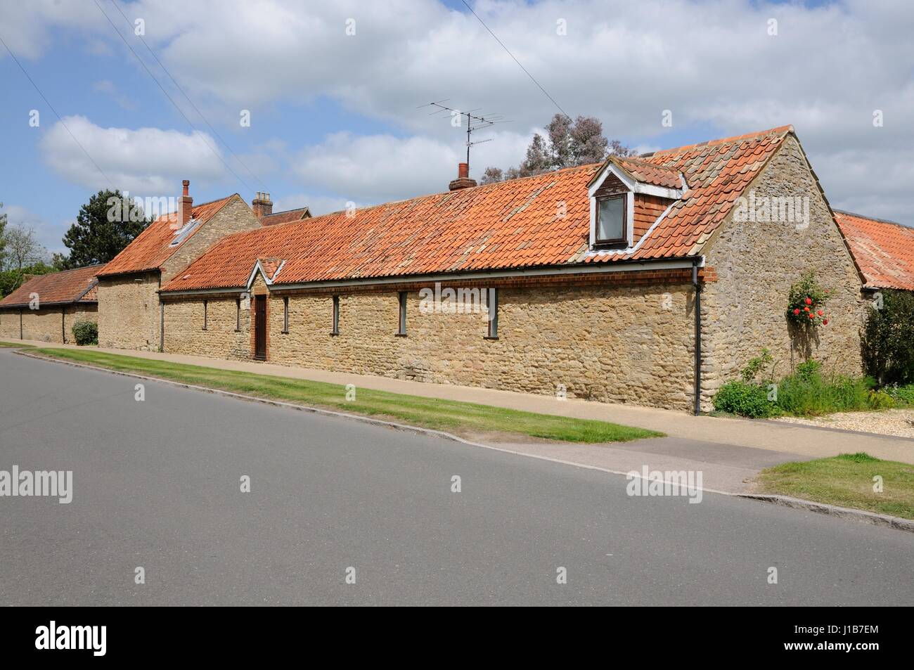 One of the variety of stone buildings in Main Road, Biddenham