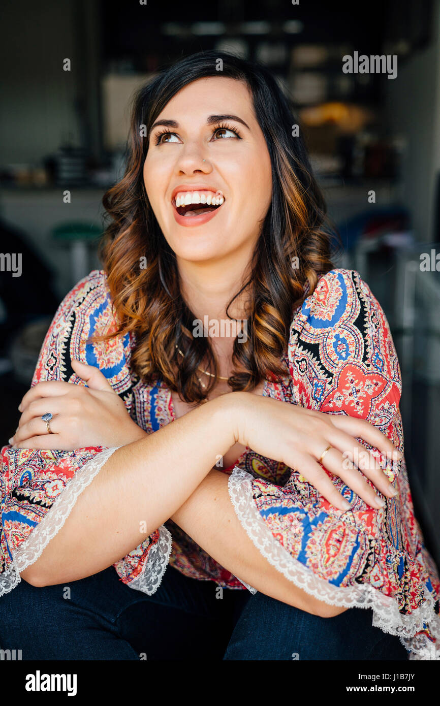 Portrait of laughing Mixed Race woman Stock Photo