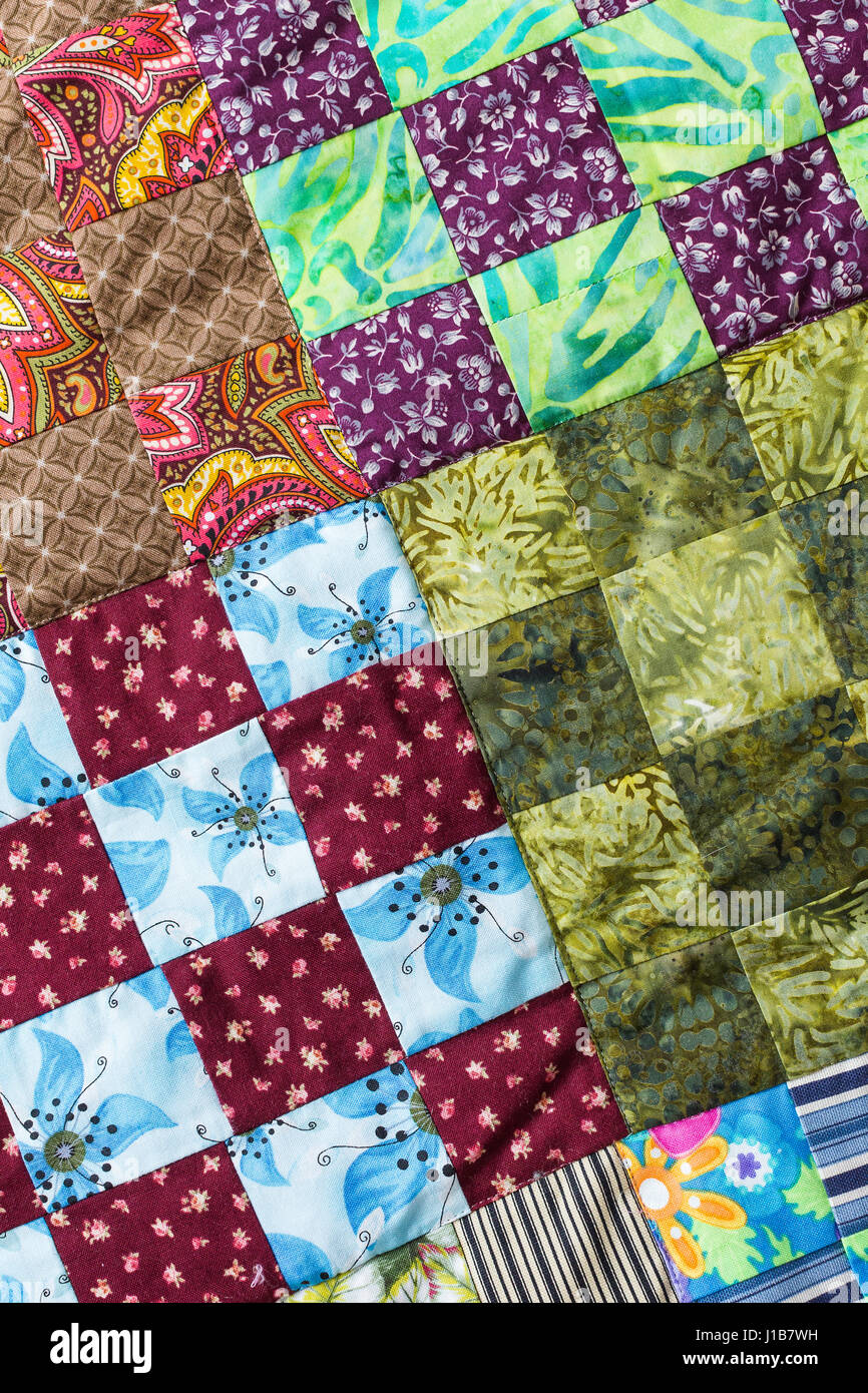 Part of symmetric geometry pattern color patchwork quilt as background.  Colorful Scrappy blanket with pattern of small squares. Handmade Stock  Photo - Alamy