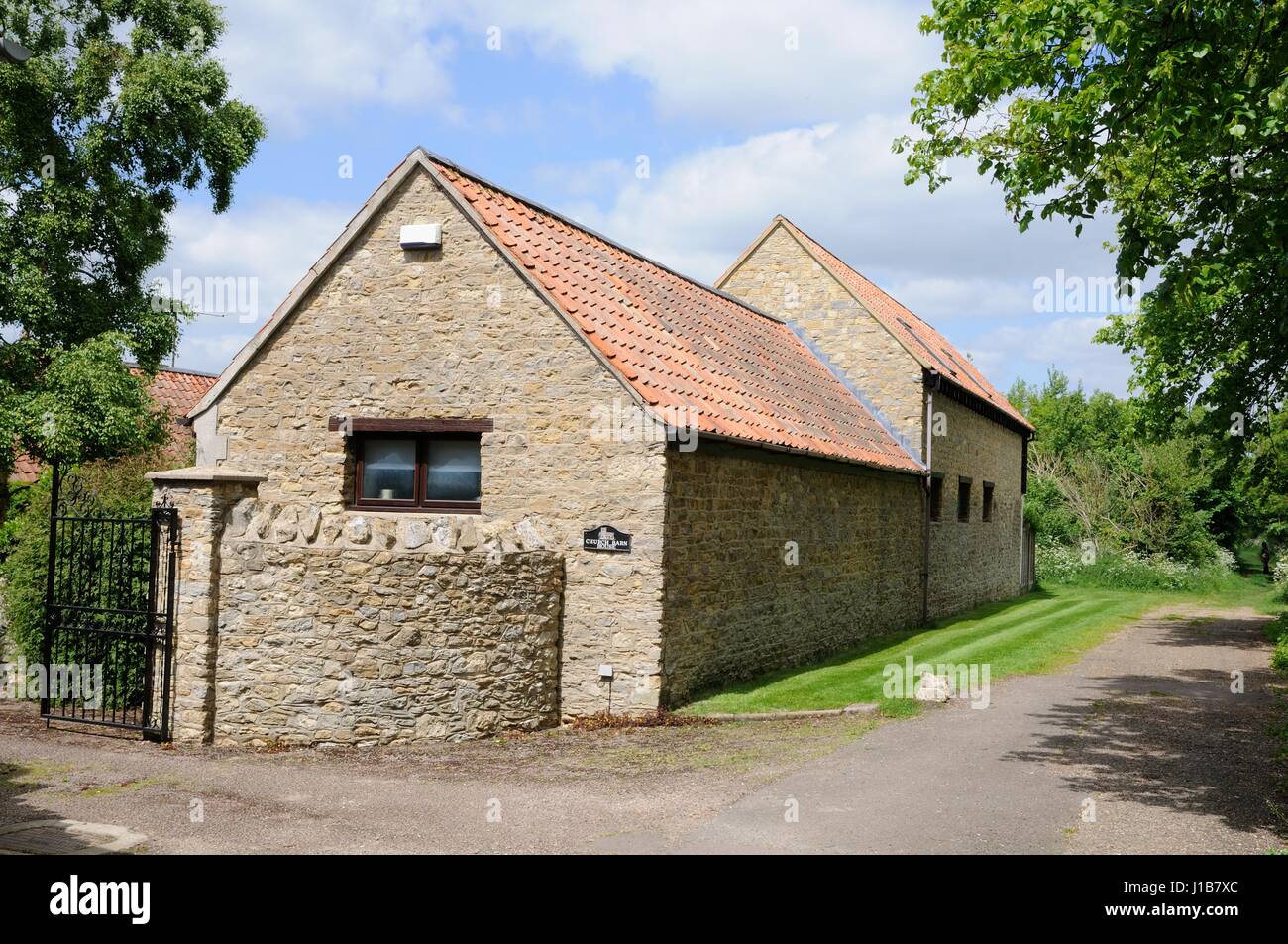 Church Barn House, Biddenham, Bedfordshire, One of a variety of stone buildings in the village it stands  in Church End. Stock Photo