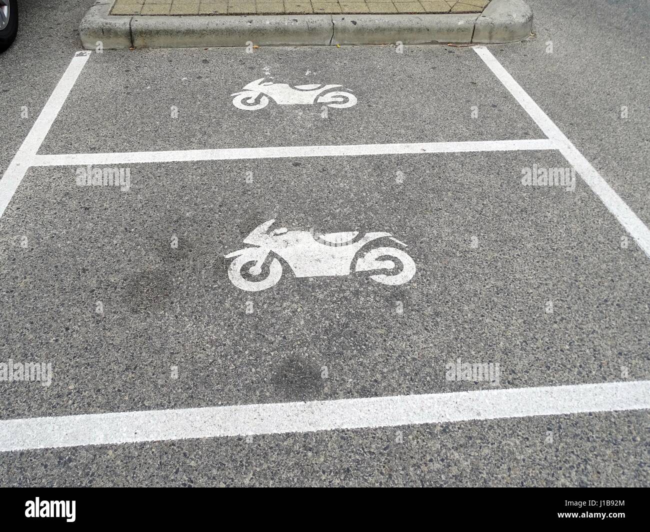 Reserved motorcycle parking spaces Stock Photo