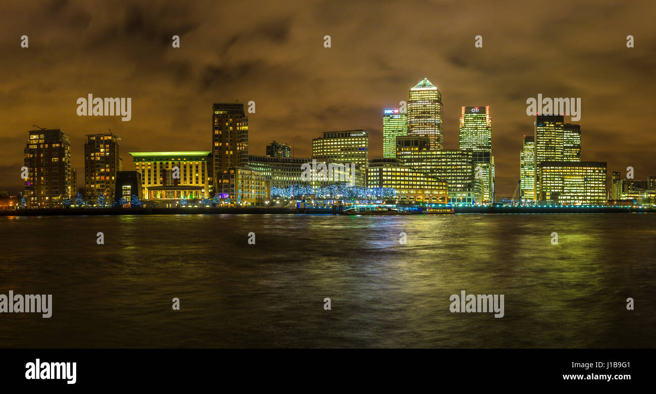Night time London skyline shot of the office buildings in Canary Wharf, Docklands, London, England Stock Photo