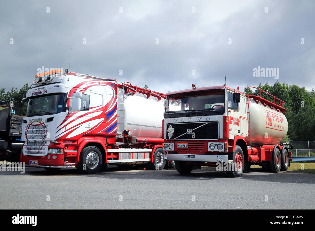 HAMEENLINNA, FINLAND - JULY 16, 2016: New Scania Euro 6 and nostalgic Volvo F1225 tank truck of SFK Kuljetus Oy side by side on Tawastia Truck Weekend Stock Photo