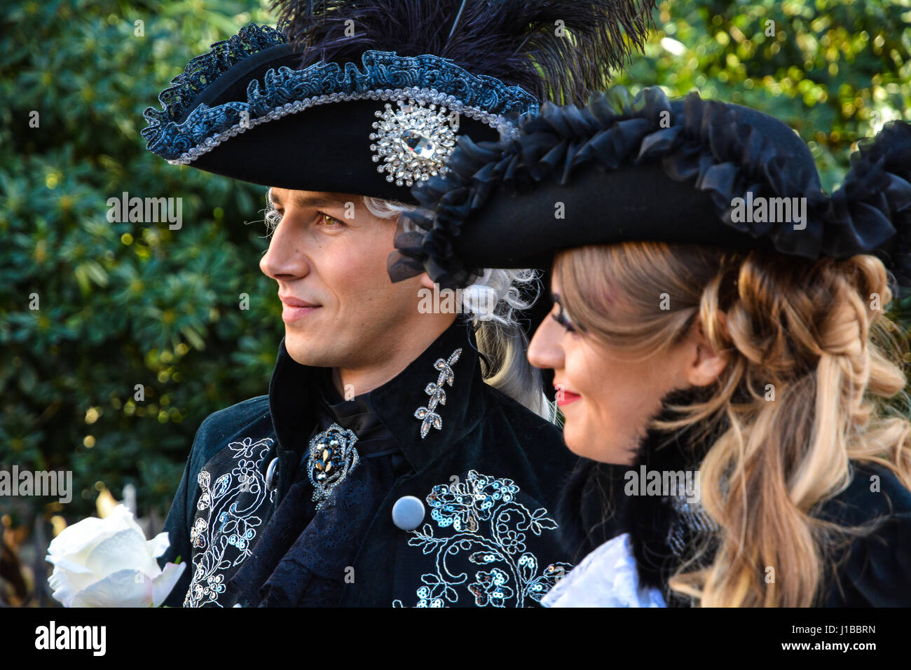 Beautiful young woman in mysterious colors Venetian mask. Fashion photo.  Holidays and celebrations Stock Photo - Alamy