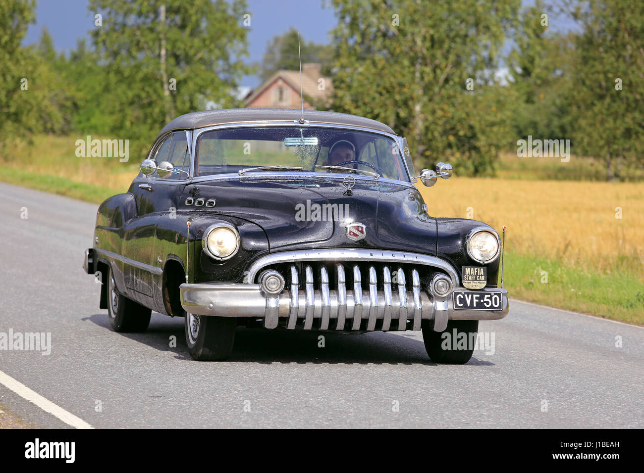 SOMERO, FINLAND - AUGUST 6, 2016: Black Buick Super Eight classic car takes part in the 90 km Maisemaruise 2016 drive along scenic roads of Tawastia P Stock Photo