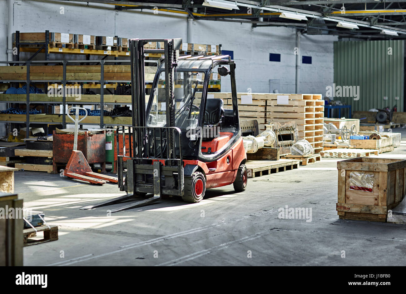 Forklift truck in warehouse standing still. Colour landscape Stock Photo