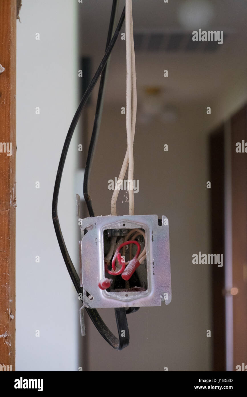 Electrical wires exposed in a junction box during a major house