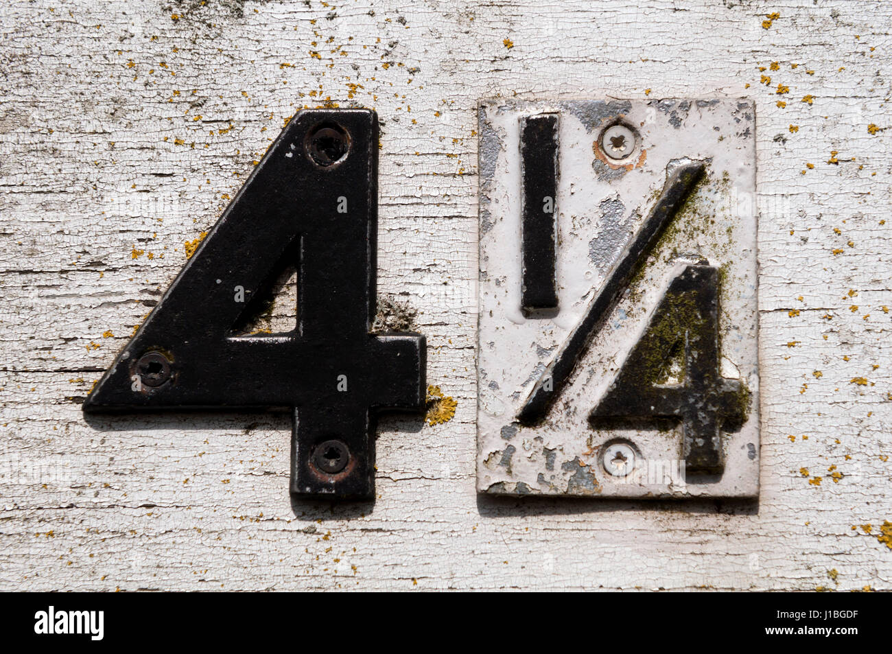 Number 4 1/4 on a road sign, Duns Tew, Oxfordshire, UK Stock Photo