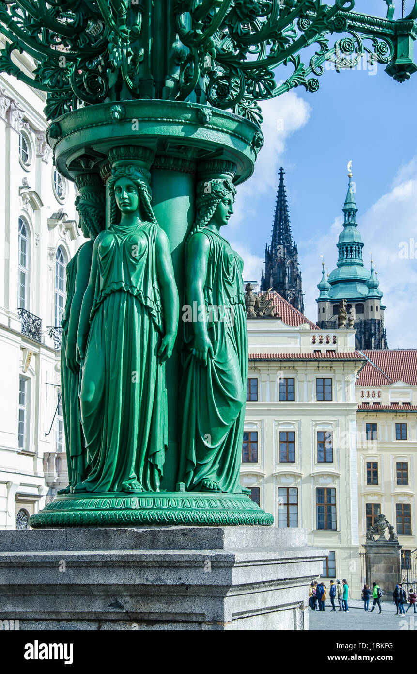 The cast-iron lamppost forged in year 1868 with its female figures on Hradcany Square near Prague Castle  is one of three left. Stock Photo