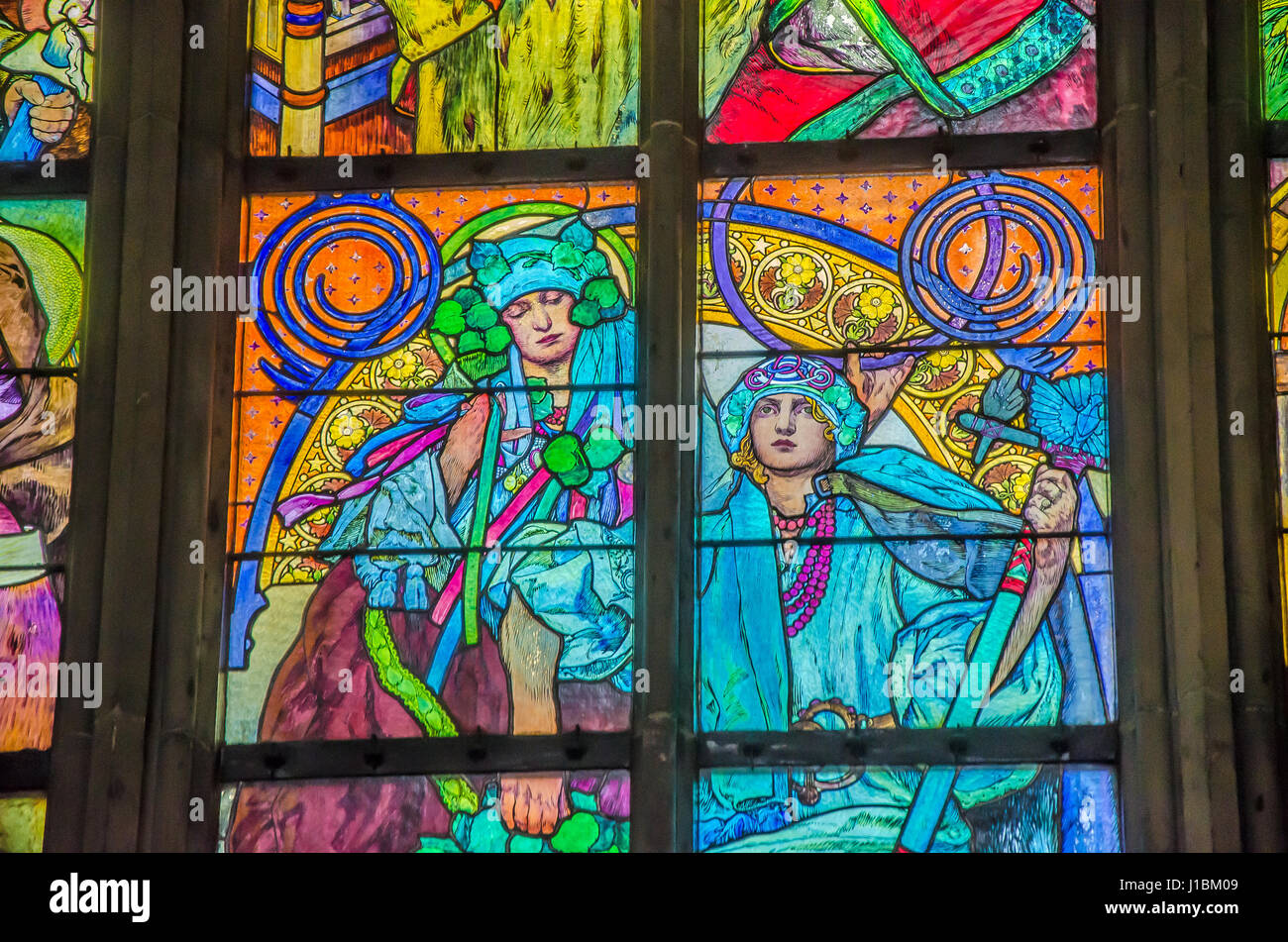 The new stained glass window, designed by Mucha, was installed in the north nave in 1931. Stock Photo