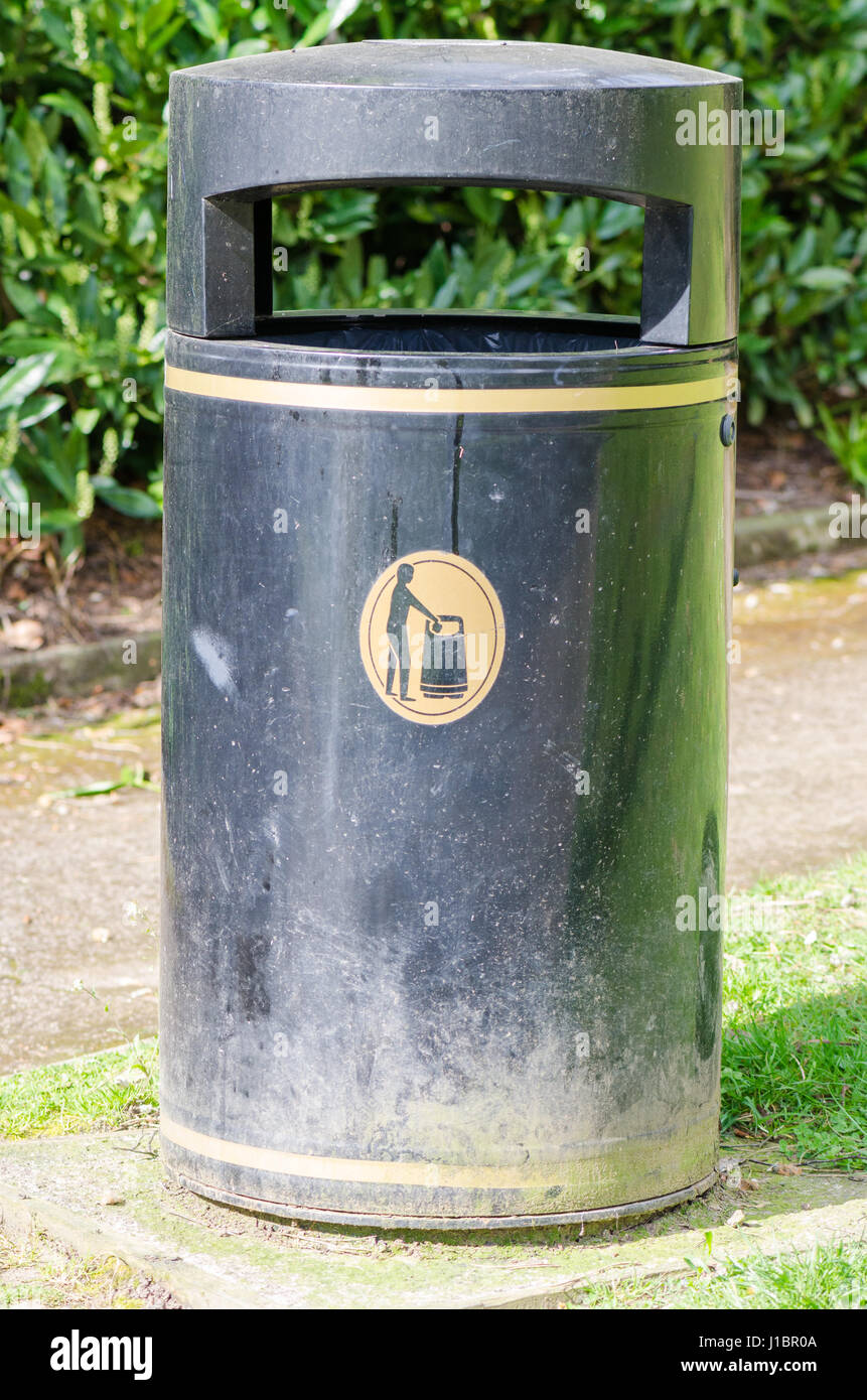 Black litter bin in a park Stock Photo