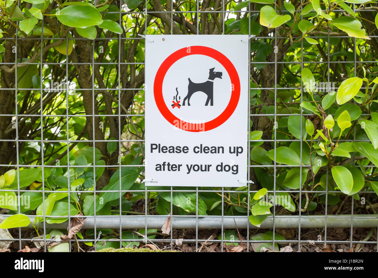 Sign saying please clean up after your dog Stock Photo