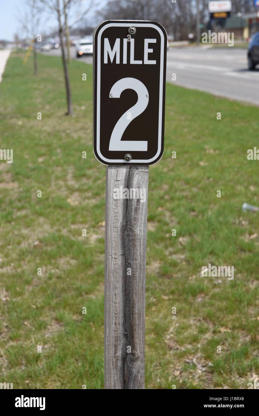 A mile marker, mile 2 Stock Photo - Alamy
