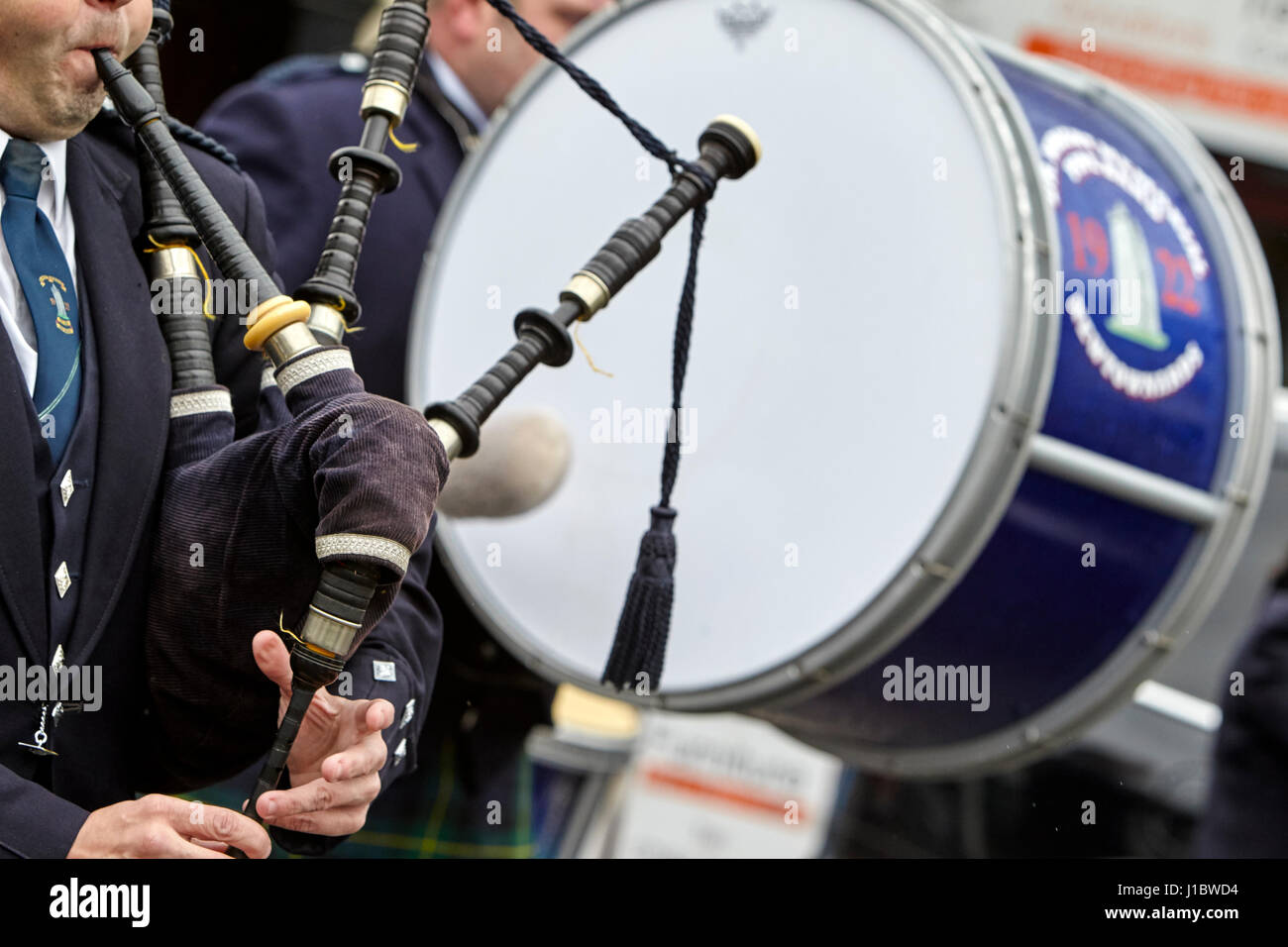 piper playing bagpipes marching band in the uk northern ireland Stock Photo