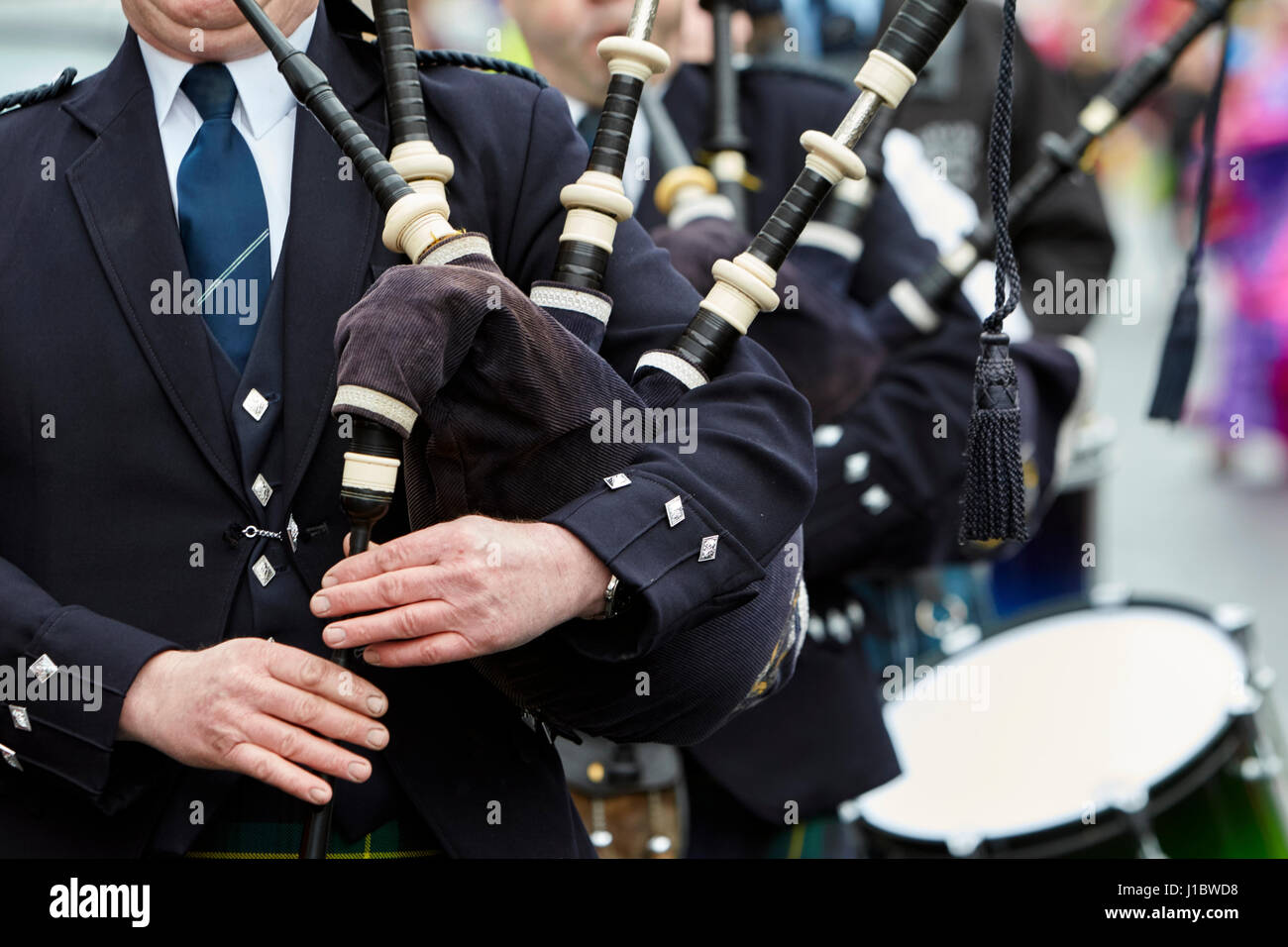 piper playing bagpipes marching band in the uk northern ireland Stock Photo